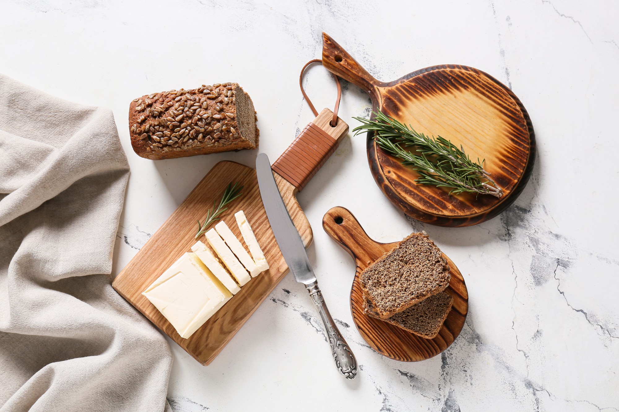 artisan bread and butter on wooden board